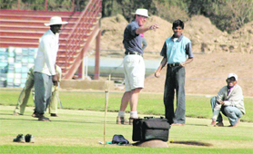 Curator Phil Russel instructs workers while giving final touches to the newly laid pitches at Tau Devi Lal Stadium, Sector 3, Panchkula.
