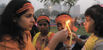 Activists from over 20 organisations participate in a candlelight procession to celebrate the South Asian Women's Day at Connaught Place in the Capital on Friday.