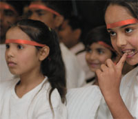 Children participate in a function of an NGO, World Vision, to raise HIV awareness in India, on the eve of Worlds AIDS Day in the Capital on Friday.