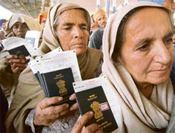 Women pilgrims queue up in front of an immigration counter at the Attari railway station after returning from Pakistan on Friday.