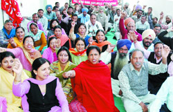 Employees of associate banks of the State Bank of India observed strike and staged a dharna in front of the State Bank of Patiala zonal complex against the proposed merger of associate banks with the SBI in Bathinda
