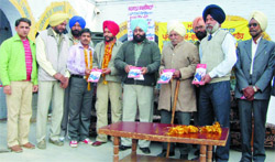 Former PPSC member Paramjit Singh releasing the book of Ram Swarn Singh Lakhowali in Gidderbaha
