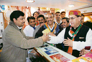 BJP candidate Suresh Bhardwaj canvasses for votes in Shimla on Monday.
