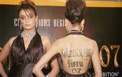A model displays the logo of ‘“Wedding Asia-07” at a press conference in Ludhiana