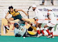 The match between Namdhari XI and Punjab National Bank in progress during the Lal Bahadur Shastri hockey tournament in New Delhi on Monday.