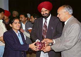 Patiala deputy commissioner D.S. Grewal (centre) and divisional commissioner S.K. Ahluwalia (right) honour the winner of fancy dress competition at Central State Library in Patiala