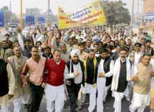 Workers of the Haryana Janhit Congress (BL) hold a protest against the government in Karnal on Thursday.