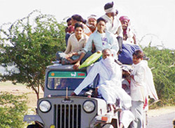 An overloaded maxi cab in Mewat. The local population is left at the mercy of private transporters due to poor services by the state roadways
