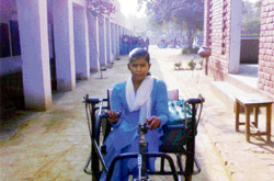 Poonam, a physically challenged girl, goes to school on her tricycle in Dhangar village