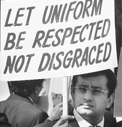 A Pakistani lawyer holds a placard during a protest near the residence of deposed Chief Justice Iftikhar Chaudhry in Islamabad