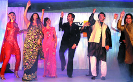 Filmmaker Karan Johar performs with TV artistes during the press conference of 'Say Shaava Shaava', the new musical entertainer, in the Captal on Friday.