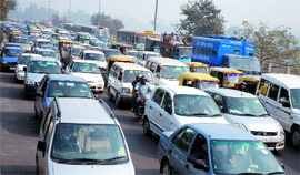 Vehicles come even on footpath due to heavy traffic jam on Ring Road in the Capital on Friday.