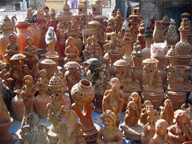 Fancy earthenware lined up for sale on a pavement in Hisar. Several potters' families from Jammu are in the town these days to sell their articles. 