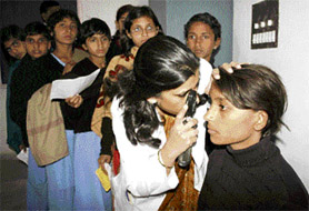 Students of government schools being examined at an eye check-up camp organised jointly by the Haryana government and the Health and Vision Society, an NGO, at Rohtak on Friday.