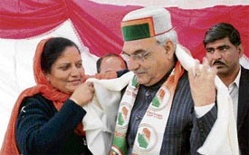 Congress candidate from Hamirpur Anita Verma presents a shawl to Haryana Chief Minister Bhupinder Singh Hooda at a rally in Sujanpur Tihra on Friday.