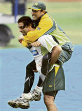 Pakistans Shoaib Akhtar carries stand-in captain Younis Khan during a practice session at the Chinnaswamy Stadium in Bangalore on Friday ahead of the third Test.