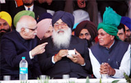 Chief Minister Parkash Singh Badal (centre), BJP leader L.K. Advani and former chief minister of Haryana Om Prakash Chautala, discuss a point during the Badals birthday celebration function in Bathinda
