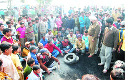 Agitated residents of Khambra protest after a villager was crushed by a speeding truck