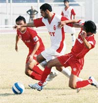 JCTs Baljit Singh Saini (centre) fights for the ball with two Churchill Brothers players during the I-League football match in Ludhiana on Saturday. 