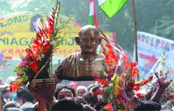 Congress workers celebrate the birthday of party president Sonia Gandhi outside her residence in the Capital on Sunday. 