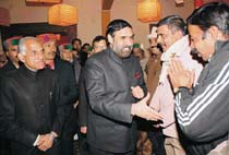Congress workers greet union minister Anand Sharma on his arrival at Shimla on Sunday evening.