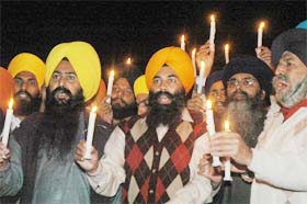 Members of All India Sikh Students Federation hold a candle light march on World Human Rights Day in Jalandhar