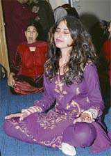 An Osho follower meditates on the occasion of Oshos birthday in Karnal on Tuesday.