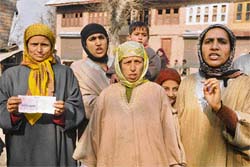 Women at Khundroo in Anantnag protest against inadequate relief provided by the civil administration in Srinagar on Monday.