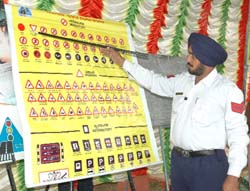 A traffic cop explaining the traffic signs at the seminar.