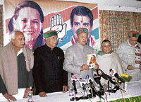 Chief Minister Virbhadra Singh (centre) releases the Congress manifesto at Dharamsala on Wednesday.