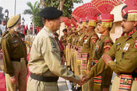 Brig M. Qaiser Khan Tareen, Deputy Director-General of Pakistan Rangers, shakes hand with a BSF jawan as he arrives along with BSF Deputy Inspector-General G.S. Virk for a meeting at the Attari border on Wednesday.