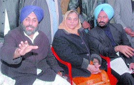 Sukhbir Badal addresses mediapersons at Kheeranwali village near Kapurthala on Thursday.