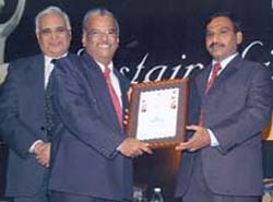 T. Sankaralingam, chairman and MD, NTPC, receives the certificate of commendation for significant achievement among the large business from union minister A. Raja at the second sustainability summit: Asia 2007.