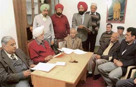 Residents of Sector 10 discuss the implications of multi-storied houses being constructed for government employees in the sector, Chandigarh