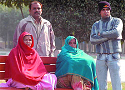 Anxious relatives of injured head constable Ramesh Chandra wait outside hospital in the Capital on Sunday.