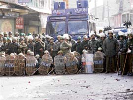 The police blocks Magam-Gulmarg road on Sunday. Magam villagers again took to streets on Sunday protesting against the killing of a civilian in Saturdays police firing.
