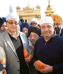 Actors Randhir and Rishi Kapoor at the Golden Temple in Amritsar on Sunday.