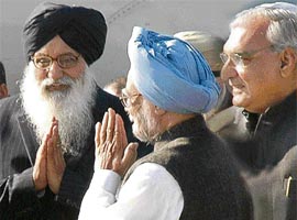 The Prime Minister, Dr Manmohan Singh, being received by Punjab Chief Minister Parkash Singh Badal and Haryana Chief Minister Bhupinder Singh Hooda at the Chandigarh airport during his brief halt in the city on Monday.