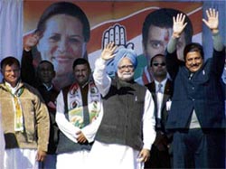 Prime Minister Manmohan Singh waves to the crowd during a rally at Bilaspur on Monday.