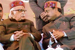 State BJP affairs in charge Satya Pal Jain interacts with L.K. Advani during a rally at Chaura Maidan in Shimla on Monday.