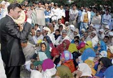 The Panipat SDM tries to pacify villagers agitating on the BPL list issue at Bal Bhawan in the city on Monday.
