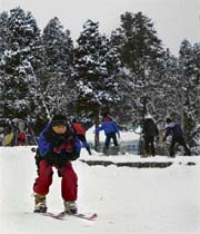 An Army soldier is skiing down a slope in the Gulmarg Ski Resort, 55 km from Srinagar, on Monday. Heavy snowfall in the area has attracted both domestic as well as foreign tourists to Gulmarg.