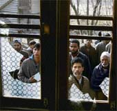 Kashmiri children look at the glass windows broken during a protest demonstration at Magam in Budgam district. 