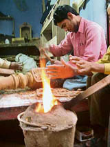 An earthern furnace being used by an artisan to keep himself warm as mercury dipped considerably in Amritsar on Tuesday.