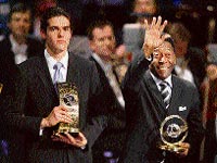 Kaka (L) holds the FIFA player of the year trophy as compatriot football legend Pele waves with the presidential award trophy during the FIFA World Player Gala 2007 award ceremony in Zurich on Monday.