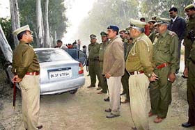 Rohtak SSP Hanif Qureshi and his team at the site of the encounter near Lakhanmajra in Rohtak district