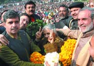 Chief Minister Sheila Dikshit being felicitated by Outer Delhi MP Sajjan Kumar and East Delhi MP Sandeep Dikshit for increasing the land compensation to farmers at her residence in the Capital on Thursday.