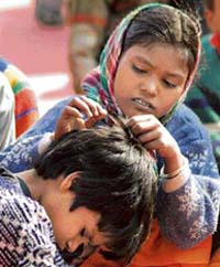 With political speeches at a childrens function failing to draw their attention, under-privileged children try hard to spend their time at Shivaji Stadium, Panipat, on Thursday afternoon.