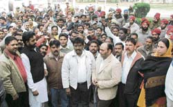 Members of the Valmiki community raise slogans outside the deputy commissioner’s office in Ludhiana on Thursday.