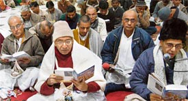 ISKCON members recite slokas from Srimad Bhagwadgita on the occasion of Gita Jayanti at Hare Krishna Dham in Chandigarh on Thursday.
